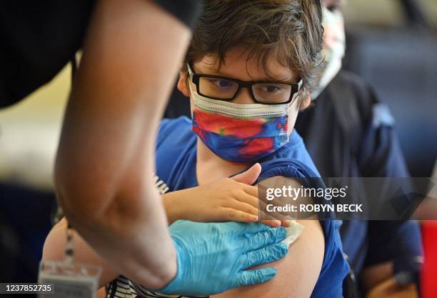 Boy receives a Covid-19 vaccine at a L.A. Care Health Plan vaccination clinic at Los Angeles Mission College in the Sylmar neighborhood in Los...