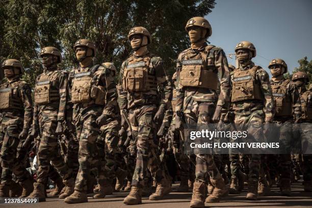 Members of the Malian Gendarmerie parade during a ceremony celebrating the army's national day, in Kati, on January 20, 2022. With the support of...