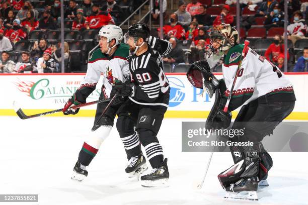 New Jersey Devils left wing Tomas Tatar in front of Arizona Coyotes goaltender Karel Vejmelka during the National Hockey League game between the New...