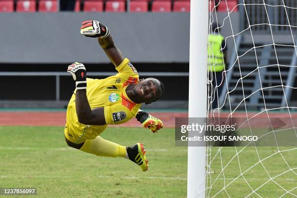 Sierra Leone's goalkeeper Mohamed Nbalie Kamara dives and concedes the opening goal during the Group E Africa Cup of Nations 2021 football match...