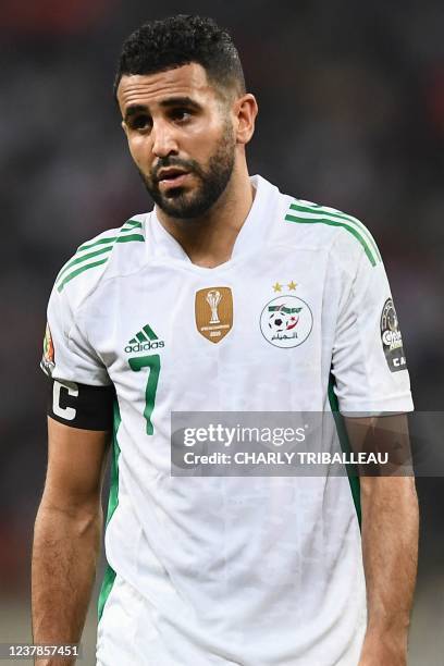 Algeria's forward Riyad Mahrez looks on during the Group E Africa Cup of Nations 2021 football match between Ivory Coast and Algeria at Stade de...
