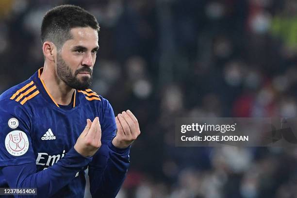Real Madrid's Spanish midfielder Isco celebrates after scoring a goal during the Copa del Rey round of 16 first leg football match between Elche CF...