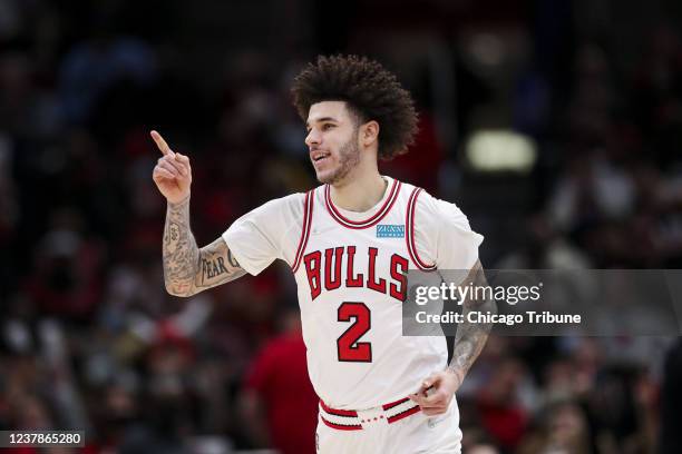 Bulls guard Lonzo Ball smiles after making a three-point-shot during the second half against the Pistons at the United Center on Jan. 11, 2022.
