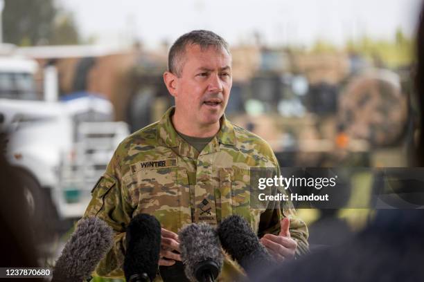 In this handout image provided by the Australian Defence Force, Major General Scott Winter, Commander Joint Task Force 637, speaks to media as...