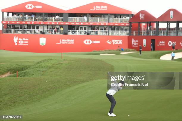 Tommy Fleetwood of England hits his third shot on the 18th hole on the 18th hole during Day Two of the Abu Dhabi HSBC Championship at Yas Links Golf...