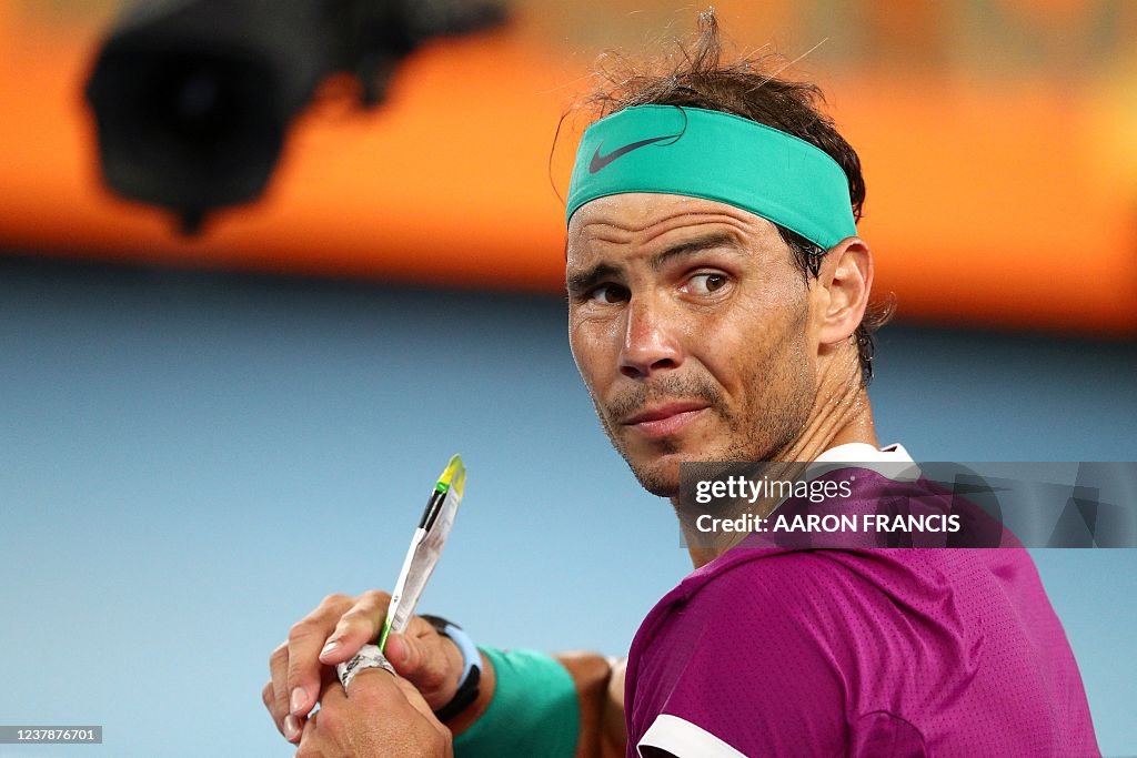 Spain's Rafael Nadal eats an energy gel as he plays against
