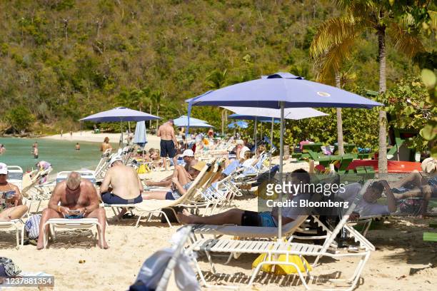 Tourists at Magens Bay beach in Saint Thomas, U.S. Virgin Islands, on Wednesday, Jan. 19, 2022. The U.S. Virgin Islands changed their entry testing...