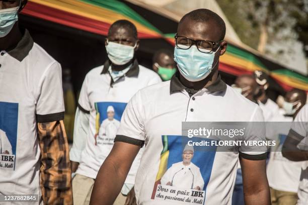 Supporter of Mali's of Mali's recently deceased ousted President, Ibrahim Boubacar Keita, parades during his state funeral in Bamako on January 21,...