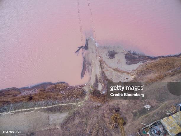 The pink waters of Henichesk Lake, where locals harvest salt, in Kherson Oblast, Ukraine, on Wednesday, Jan. 19, 2022. President Joe Biden said...