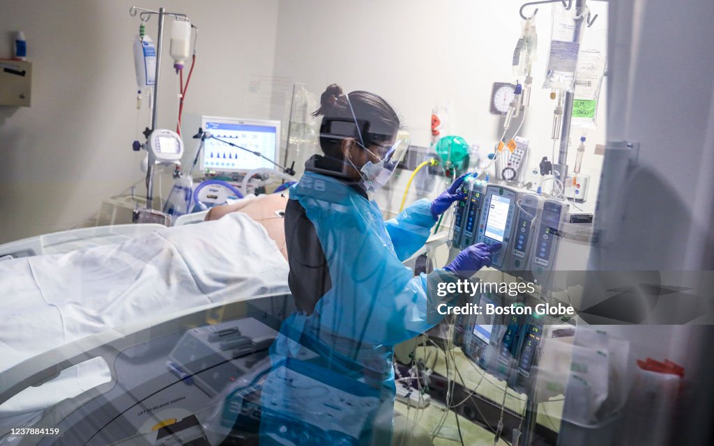 Nurse Treats Patient In ICU