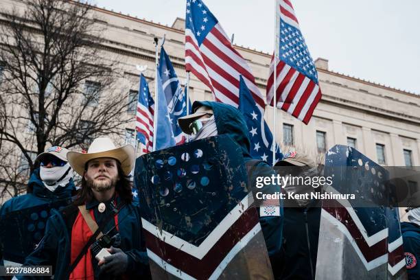 Members of the right-wing group, the Patriot Front, and their founder, Thomas Ryan Rousseau, second from left, prepare to march with anti-abortion...