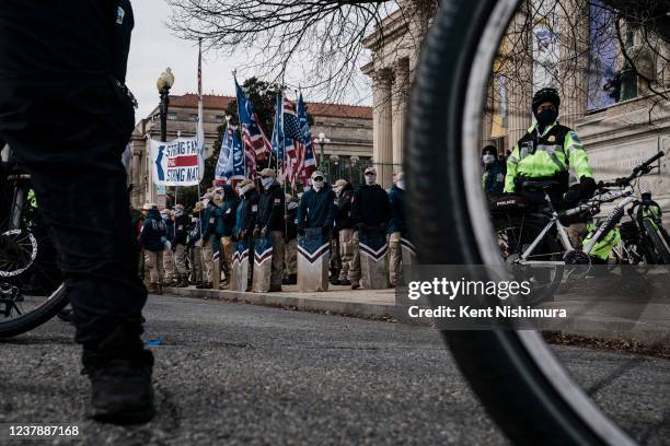 Members of the right-wing group, the Patriot Front, are surrounded by a protective ring of DC Metropolitan Police Officers as they prepare to march...