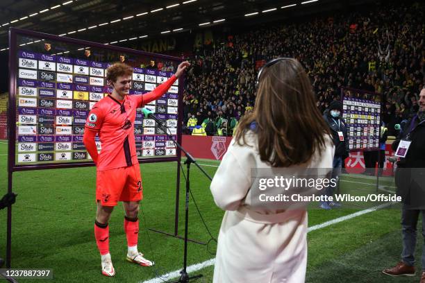 The Norwich crowd cheers as goalscorer Josh Sargent of Norwich waves to them during his post-match interview after the Premier League match between...