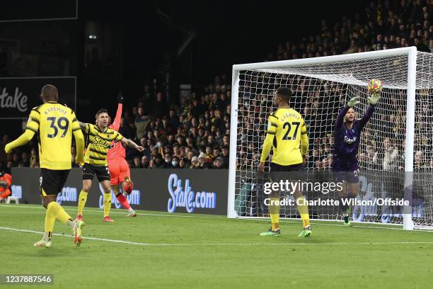 Watford goalkeeper Daniel Bachmann collects the ball as it bounces off the crossbar but the ball has gone over the line for the first Norwich goal...