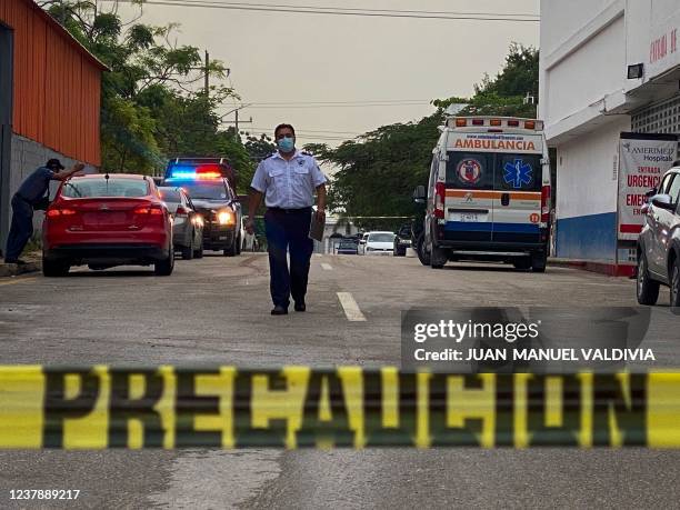 An ambulance remains outside the Playamed hospital, where a wounded person was transferred after a shooting in a Hotel in Xcaret, Playa del Carmen,...