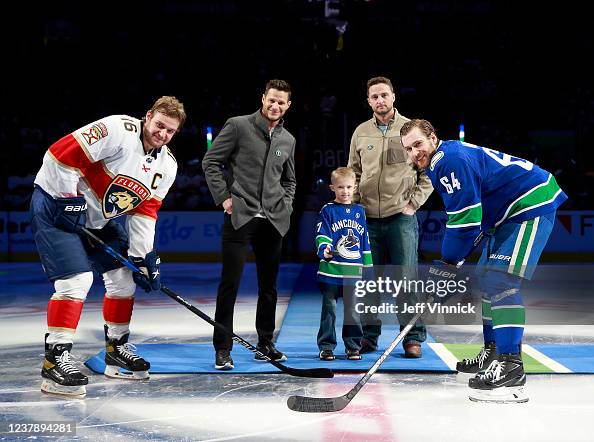Kevin Bieksa, Wes Rypien, and Joe Rypien drop the puck for Tyler ...