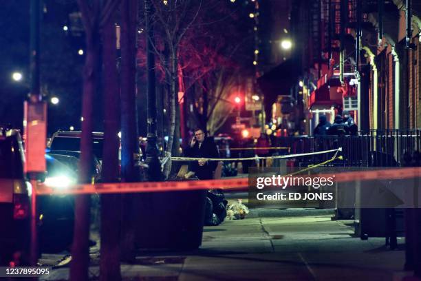 General view shows the taped off area marking the scene of a shooting in Harlem, New York on January 22, 2022. - New York's mayor called on the...