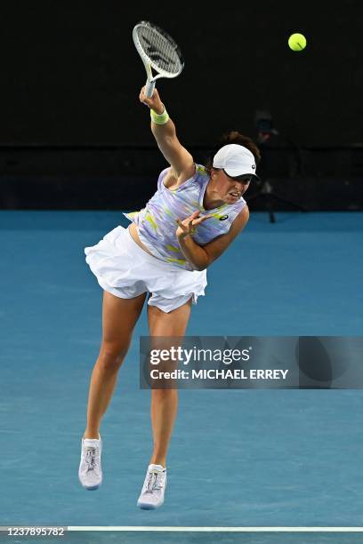 Poland's Iga Swiatek serves against Russia's Daria Kasatkina during their women's singles match on day six of the Australian Open tennis tournament...