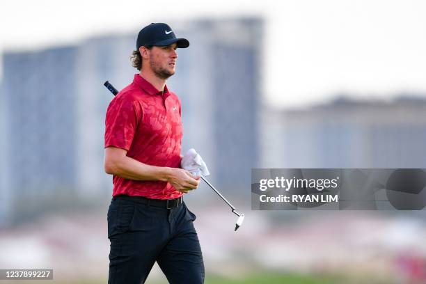 Thomas Pieters of Belgium walks after playing a shot at the 18th hole during the third round of the Abu Dhabi HSBC championship at Yas Links Golf...