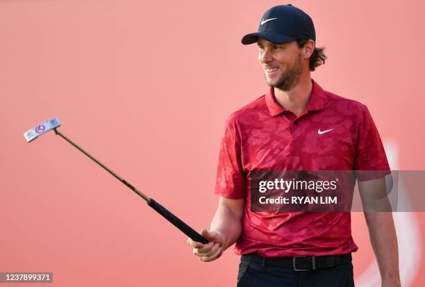 Thomas Pieters of Belgium reacts after playing a shot at the 18th hole during the third round of the Abu Dhabi HSBC championship at Yas Links Golf...