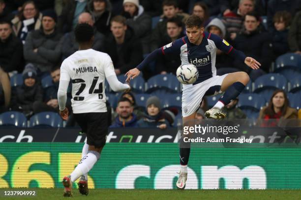 Conor Townsend of West Bromwich Albion and Bali Mumba of Peterborough United during the Sky Bet Championship match between West Bromwich Albion and...