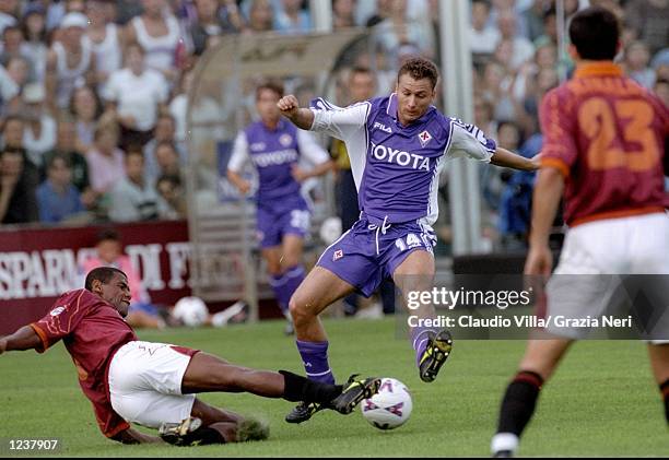 Aldair of Roma slides in on Sandro Cois of Fiorentina during the Serie A match at the Artemio Franchi Stadium in Florence, Italy. Roma won 3-1. \...