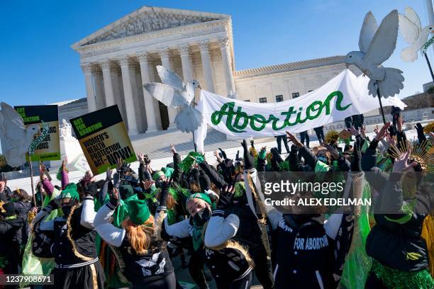 Pro-choice activists participate in a "flash-mob" demonstration outside of the US Supreme Court on January 22, 2022 in Washington, DC. - January 22...