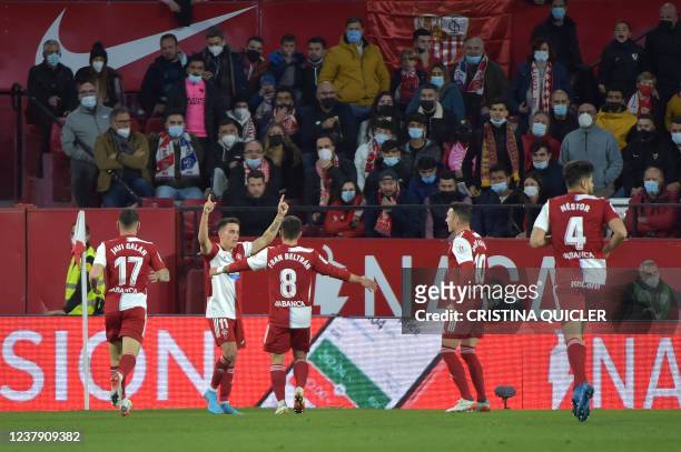 Celta Vigo's Argentinian midfielder Franco Cervi celebrates after scoring the opening goal during the Spanish league football match between Sevilla...