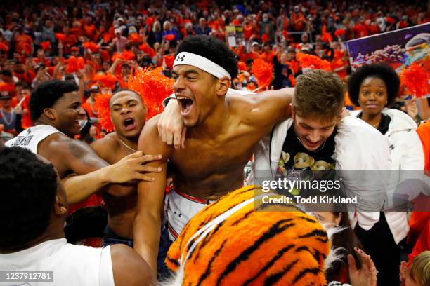 Dylan Cardwell of the Auburn Tigers reacts with fans in the stands after the win against the Kentucky Wildcats at Auburn Arena on January 22, 2022 in...