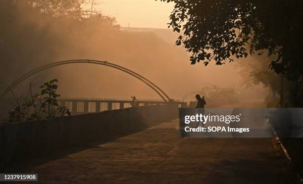 Sweeper cleans a Street early morning in Mumbai.