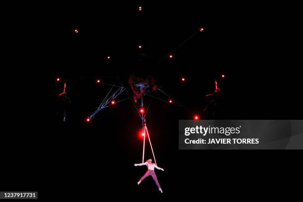 Artists of the French company Gratte Ciel perform 'Rouge!', an aerial and ground acrobatics show during the Santiago a mil 2022 Festival, in Santiago...