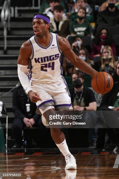 Buddy Hield of the Sacramento Kings dribbles the ball during the game against the Milwaukee Bucks on January 22, 2022 at the Fiserv Forum Center in...