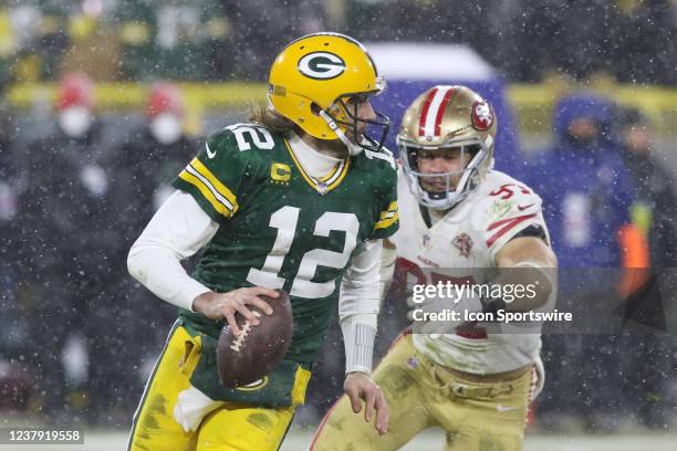 San Francisco 49ers defensive end Nick Bosa chases Green Bay Packers quarterback Aaron Rodgers during the NFC Divisional playoff game between the...