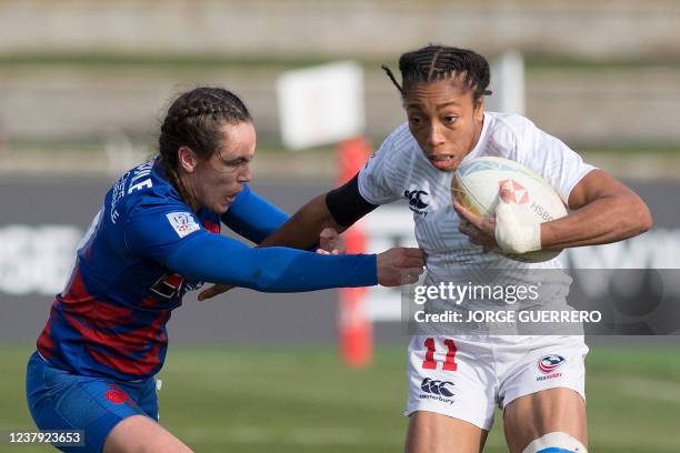 France's Jade Ulutule challenges USA's Kris Thomas during the Women's HSBC World Rugby Sevens Series 2022 semi-final match between USA and France at...
