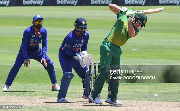 South Africa's David Miller plays a shot as India's wicketkeeper Rishabh Pant and slip fielder Virat Kohli look on during the third one-day...