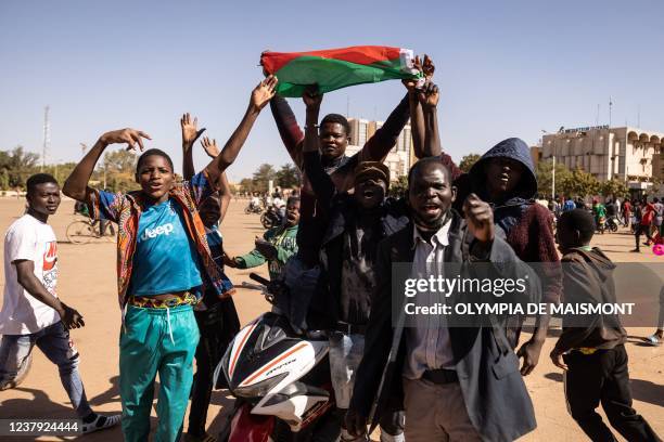 People gather at Nation square to support military in Ouagadougou on January 23, 2022. - Gunfire broke out at several army barracks in Burkina Faso...