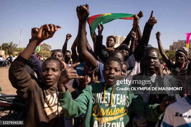 People gather at Nation square to support military in Ouagadougou on January 23, 2022. - Gunfire broke out at several army barracks in Burkina Faso...