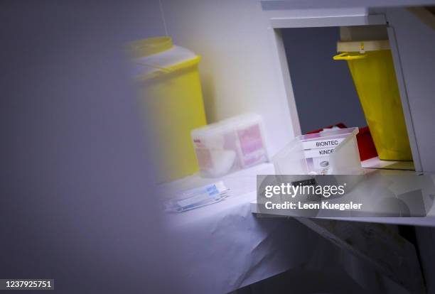 Syringes set up with the BioNTech/Pfizer vaccine dosed for children lay prepared for usage in boxes at a test and vaccination centre set up at a car...