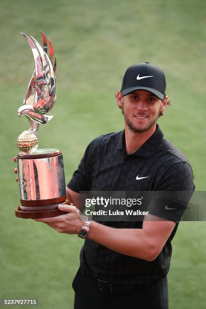 Thomas Pieters of Belgium poses with the trophy after his victory during Day Four of the Abu Dhabi HSBC Championship at Yas Links Golf Course on...