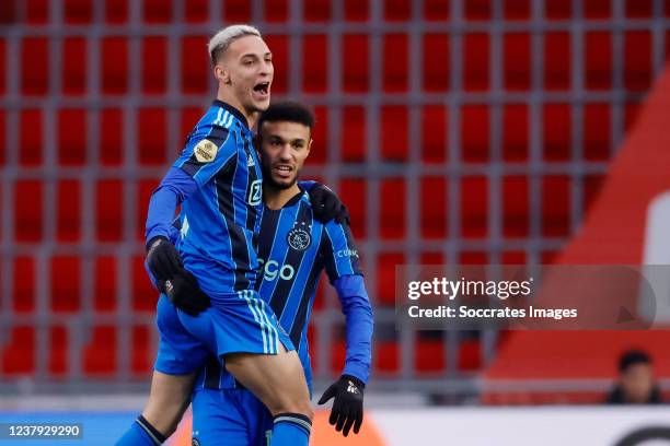 Noussair Mazraoui of Ajax celebrates with Antony of Ajax during the Dutch Eredivisie match between PSV v Ajax at the Philips Stadium on January 23,...