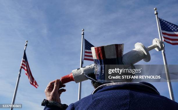 Demonstrators participate in a Defeat the Mandates march in Washington, DC, on January 23, 2022. - Demonstrators are protesting mask and Covid-19...