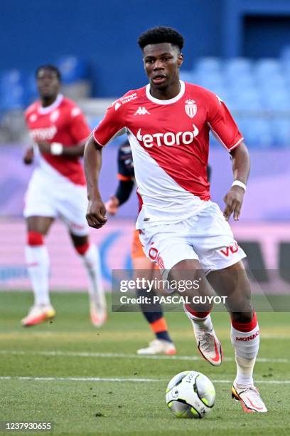 Monaco's French midfielder Aurelien Tchouameni runs with the ball during the French L1 football match between Montpellier Herault SC and AS Monaco at...