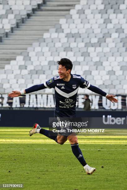 Bordeaux's Korean forward Ui-jo Hwang celebrates after scoring a goal during the French L1 football match between Bordeaux and Strasbourg at the...