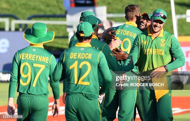 South Africa's cricketers celebrate after victory in the third one-day international cricket match between South Africa and India at Newlands Stadium...