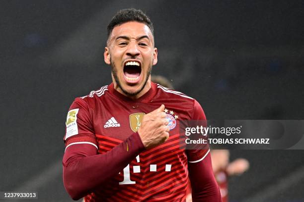 Bayern Munich's French midfielder Corentin Tolisso celebrates scoring the 0-1 goal during the German first division Bundesliga football match between...