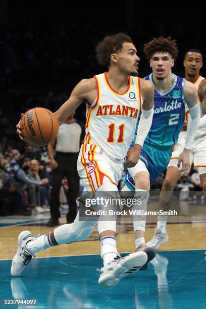 Trae Young of the Atlanta Hawks drives to the basket during the game against the Charlotte Hornets on January 23, 2022 at Spectrum Center in...