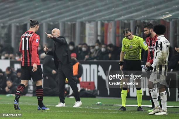 Zlatan Ibrahimovic of AC Milan exits the pitch as Olivier Giroud of AC Milan enters during the Italian Serie A football match between AC Milan and...