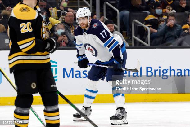 Winnipeg Jets center Adam Lowry waits for a face off during a game between the Boston Bruins and the Winnipeg Jets on January 22 at TD Garden in...