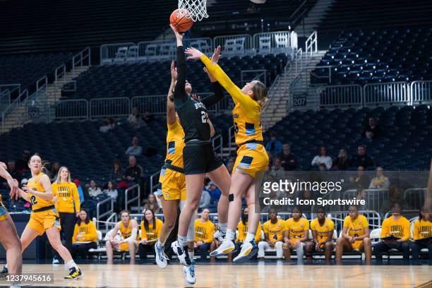 Butler Bulldogs forward Alex Richard scores over Marquette Golden Eagles guard Jordan King in the lane during the womens college basketball game...