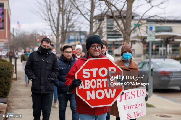 Anti-abortion protesters march from the Monroe County Courthouse around Planned Parenthood and back to the courthouse during the Rally for Life in...